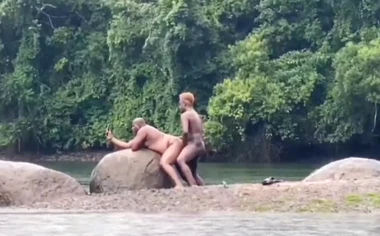 Fucking in the river in the rain with a hot bear and another hottie
