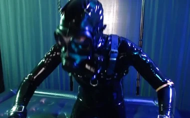 Rubberboy with gas mask pisses and cums